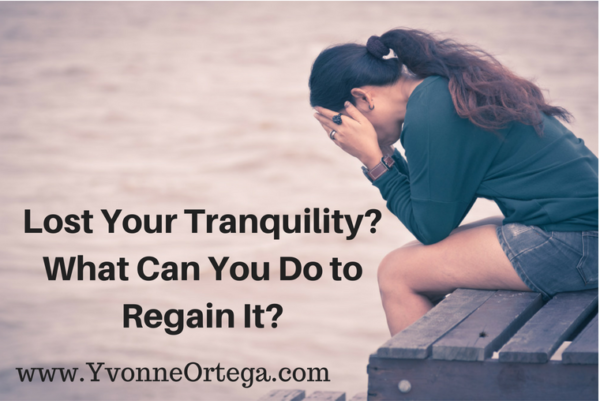 Woman seated alone on wooden chair without tranquility